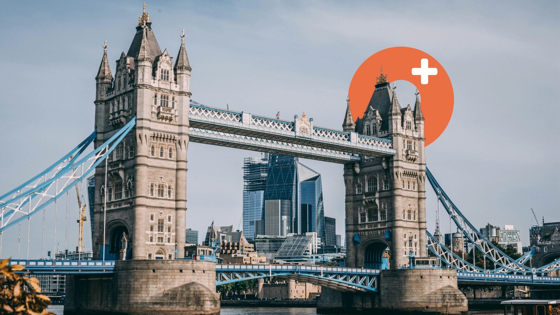 Tower Bridge in London with Octoplus venue listings service logo overlay and city skyline in the background