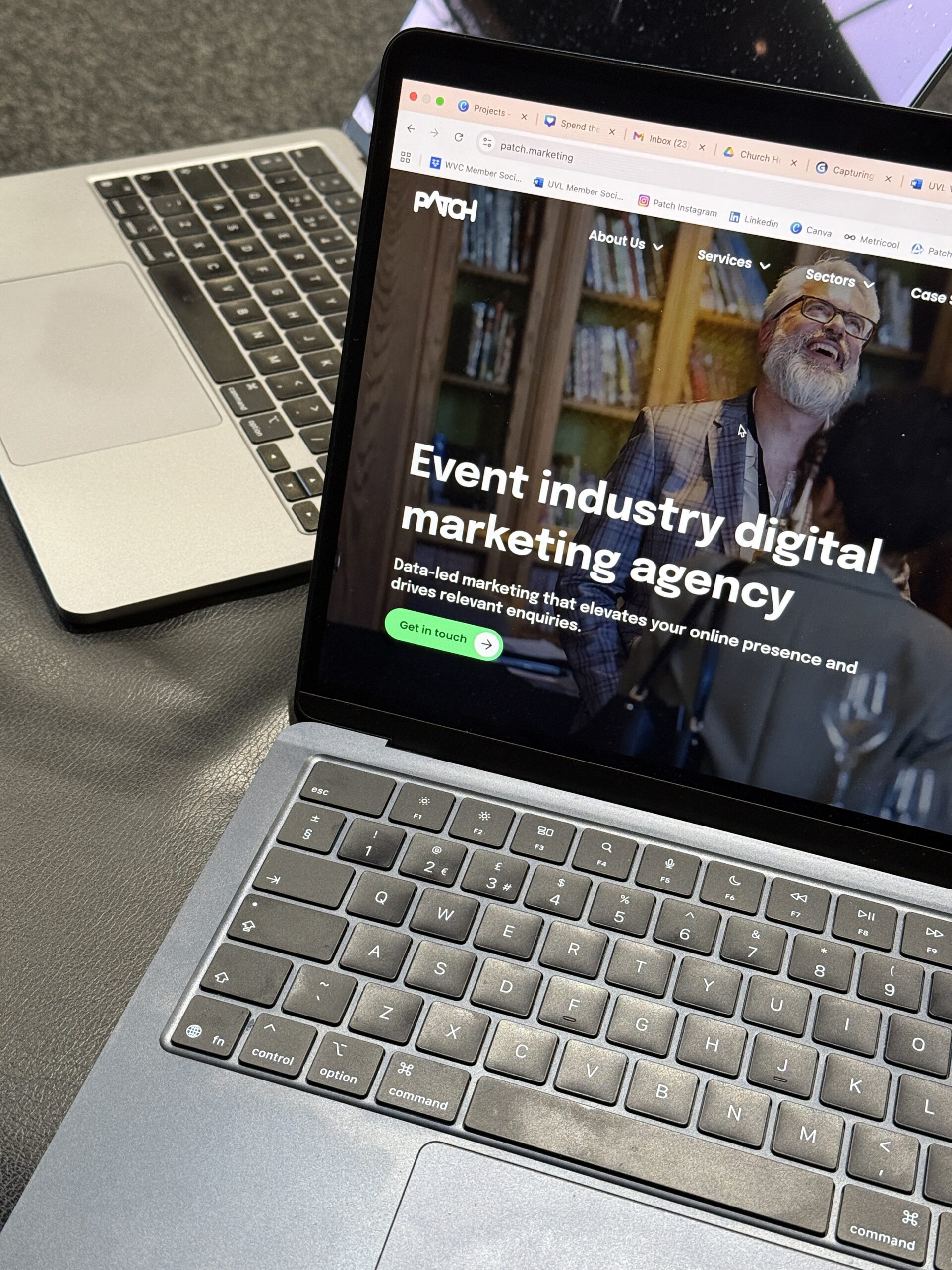 A MacBook laptop displaying the Patch Marketing website homepage, showing the headline 