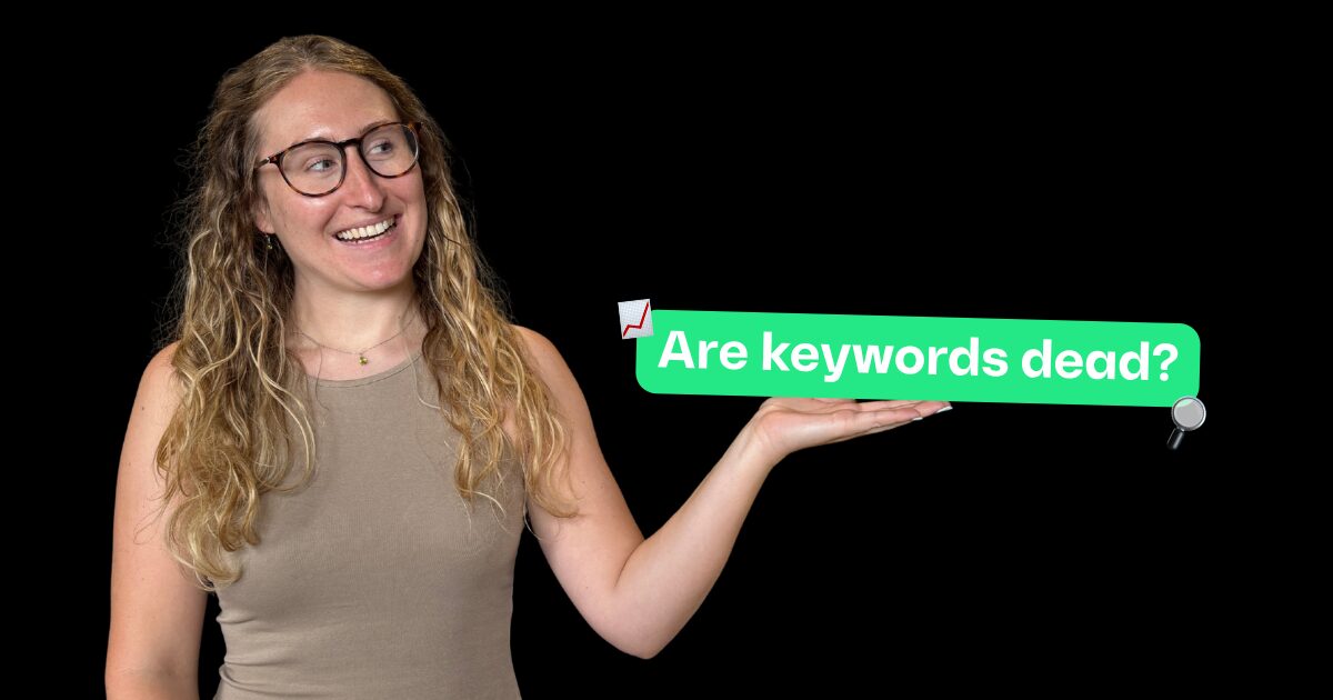 Georgia holding a text box in her hands reading 'are keywords dead?'
