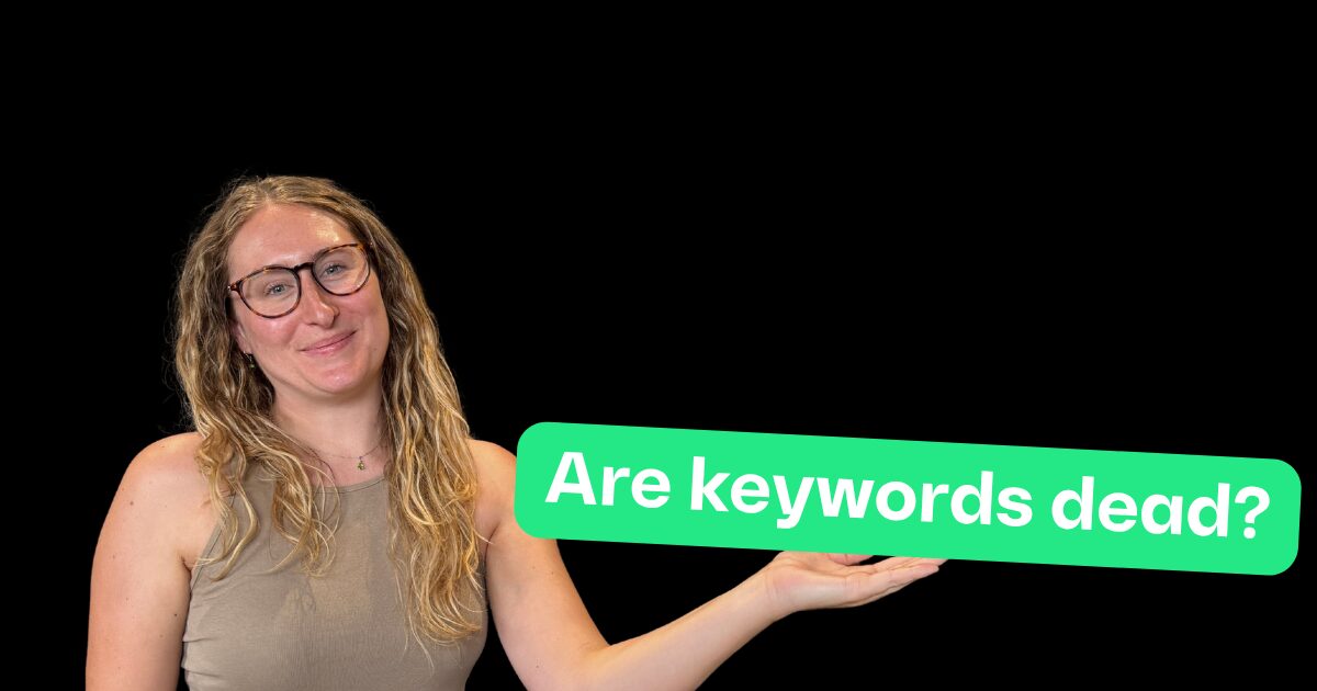 Georgia holding a text box in her hands reading 'are keywords dead?'